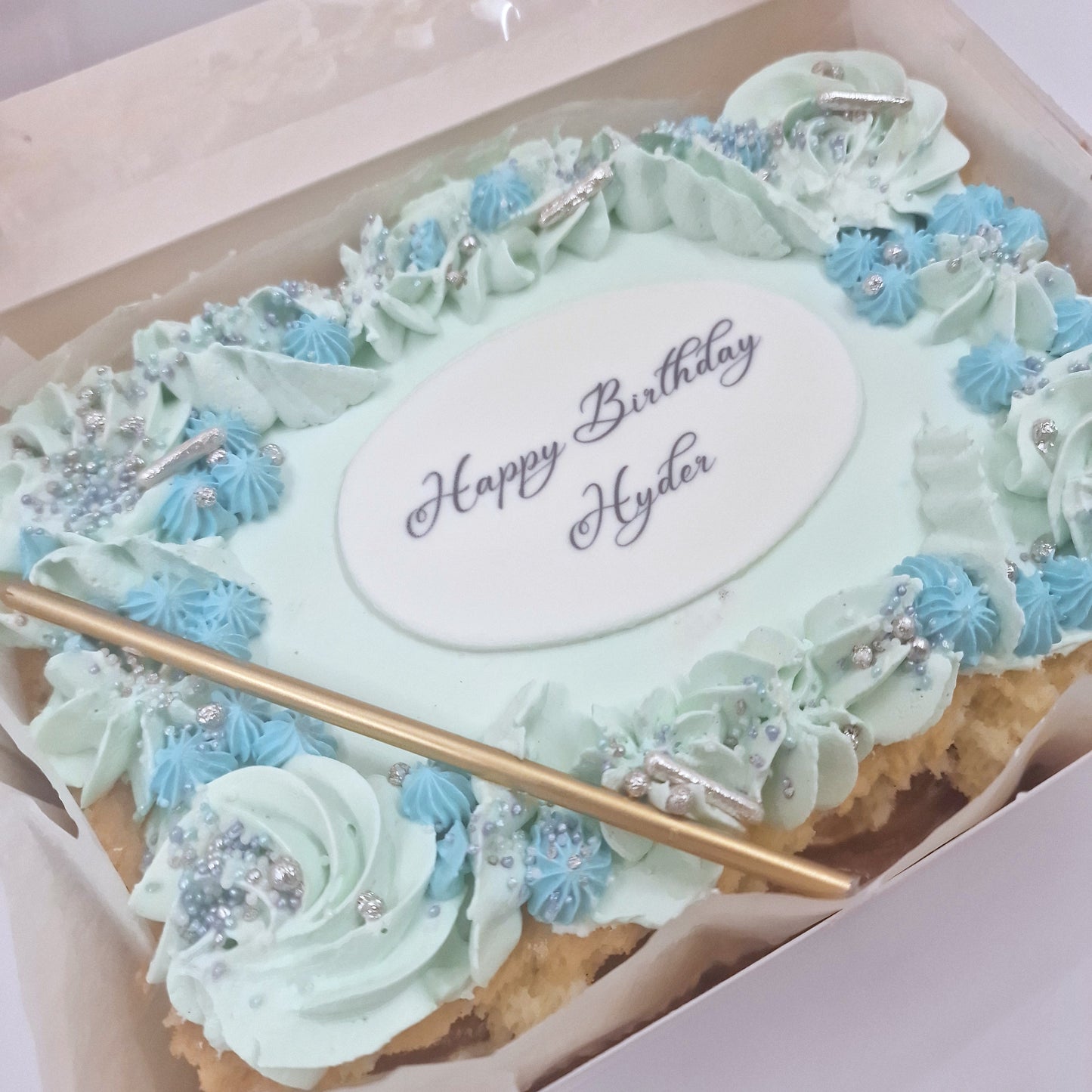 Envision a small 8-serving cake, light and fluffy vanilla sponge adorned with a cloud-like swirls of pastel-colored buttercream. Ideal for small gatherings or as a sweet surprise to mark a special birthday, this cake is a celebration in itself. To elevate the moment, a slender, elegant candle graces the top, ready to illuminate the occasion with a flicker of warmth.