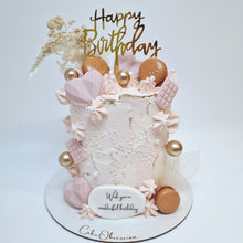 Load image into Gallery viewer, Indulge in a beautiful birthday cake adorned with soft pink buttercream, topped with elegant dried flowers and delectable macaroons. The color of the macaroons and dried flowers may vary based on stock availability, ensuring a unique and personalized touch to each cake. Perfect for making any celebration extra special.