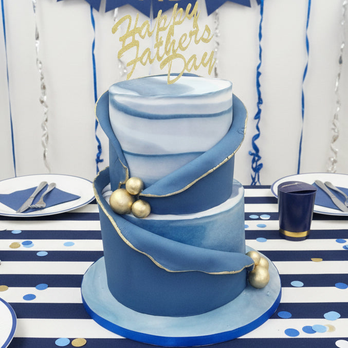 men’s two-tier blue marble cake with golden details made in Basildon Essex