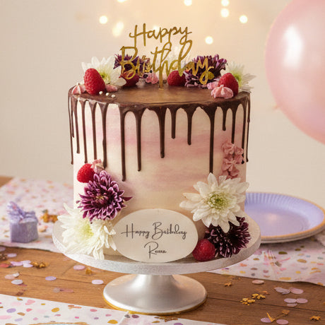 White & Pink Chocolate Drip Celebration Cake with smooth buttercream, chocolate drip, fresh berries, and delicate flowers, handmade and personalised, perfect for birthdays, weddings, baby showers, and elegant celebrations, available for delivery in Basildon and Essex.
