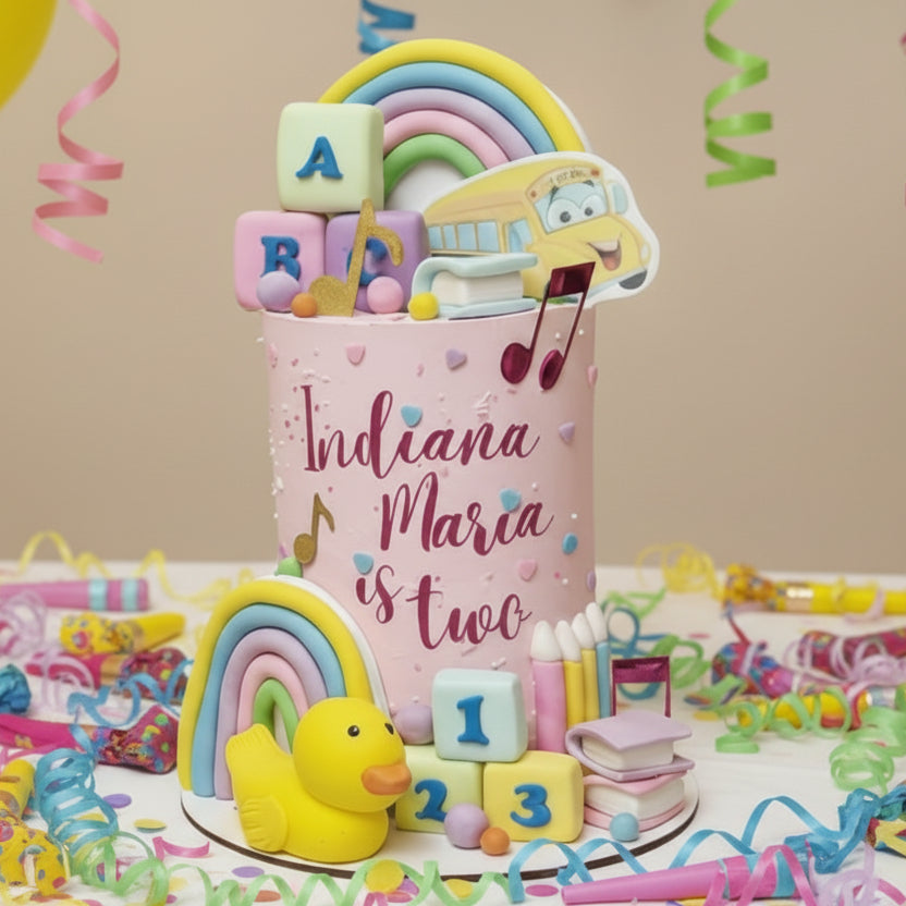 Bright rainbow children’s birthday cake with colourful buttercream, playful decorations and personalised age topper, designed for a toddler party in Basildon, Essex.