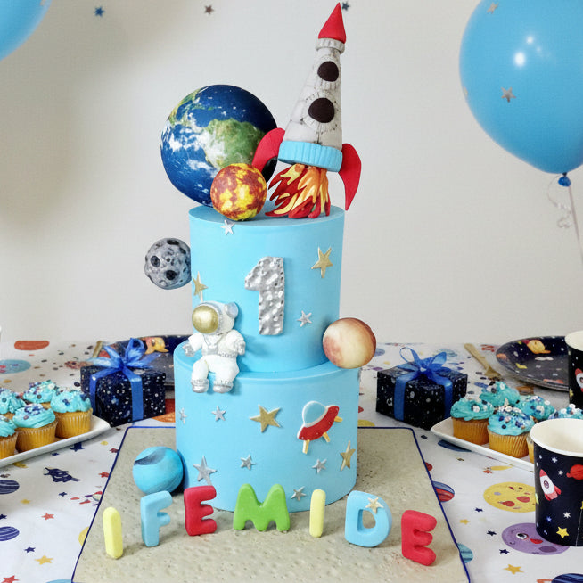 Space-themed birthday cake with planets, rocket, and spaceman figure, personalised name and age, birthday cake delivery Basildon Essex