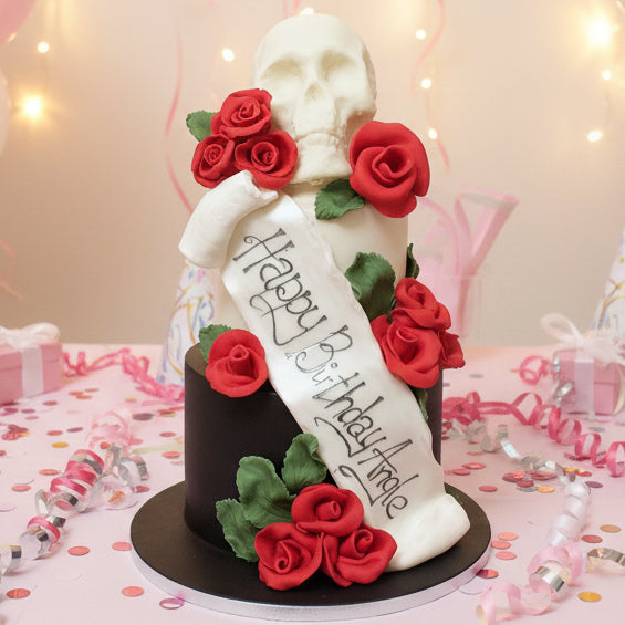 Black skull cake with red roses made in Basildon Essex for gothic celebration