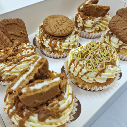 Close-up of biscoff cupcakes, featuring fluffy cupcakes topped with creamy buttercream, a drizzle of biscoff spread, and a lotus biscoff cookie garnish."