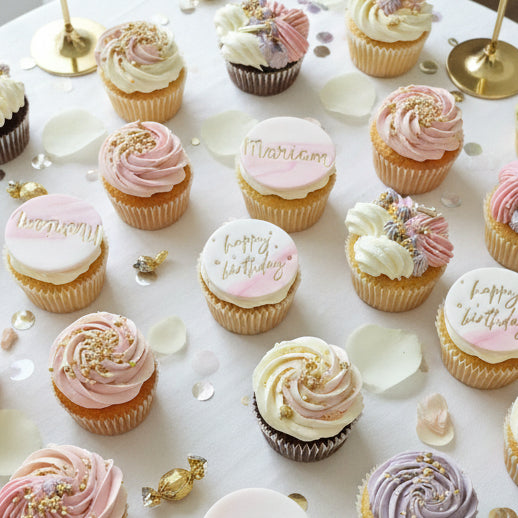 Pink, white, and lavender cupcakes with gold toppers for delivery in Basildon Essex