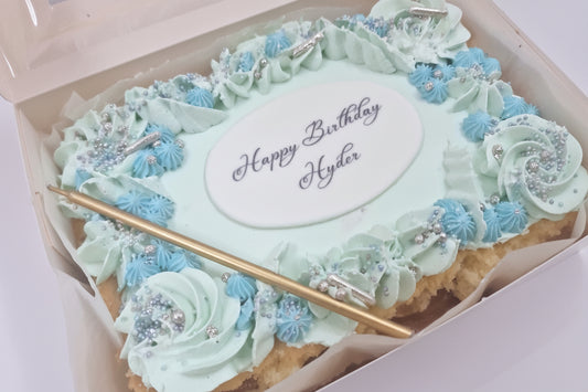 Pastel Vanilla Celebration Cake with light vanilla sponge, cloud-like pastel buttercream swirls, and elegant candle, handmade and perfect for small birthdays and intimate celebrations, available for delivery in Basildon and Essex.