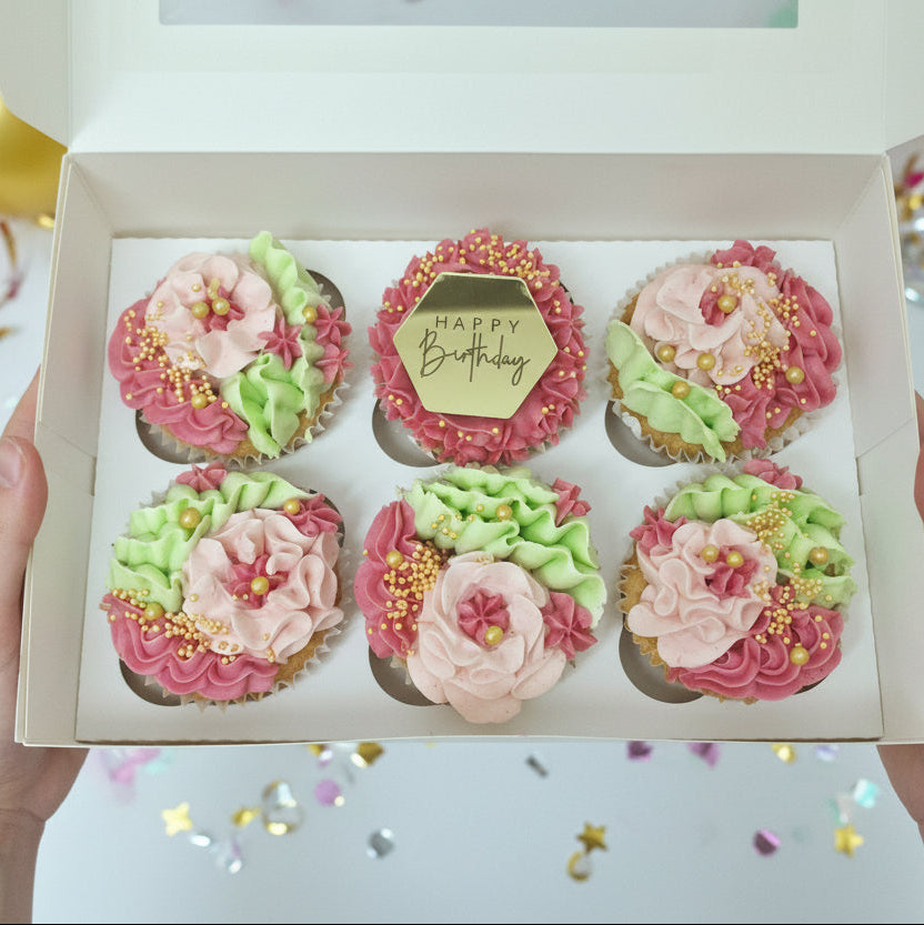 Pink birthday cupcakes with gold Happy Birthday topper and personalised fondant discs for delivery in Basildon Essex