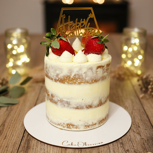 Semi-Naked Strawberry Celebration Cake with fluffy sponge layers, light buttercream coating, and fresh strawberries on top, handmade and personalised, perfect for birthdays, anniversaries, and special occasions, available for delivery in Basildon and Essex.
