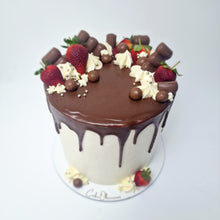 Load image into Gallery viewer, Cake covered in vanilla buttercream with chocolate drip decorated with strawberries and chocolates
