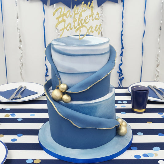 men’s two-tier blue marble cake with golden details made in Basildon Essex