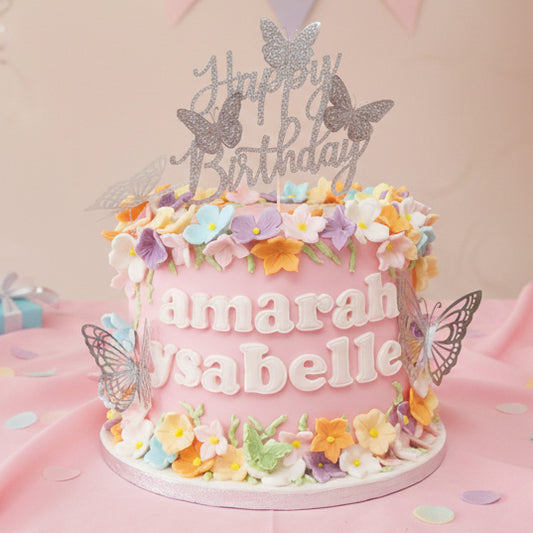 Pink butterfly birthday cake made in Basildon Essex with flowers for girls celebration