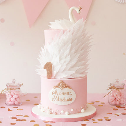 Swan cake made in Basildon Essex with handcrafted swan and edible feathers for special occasions