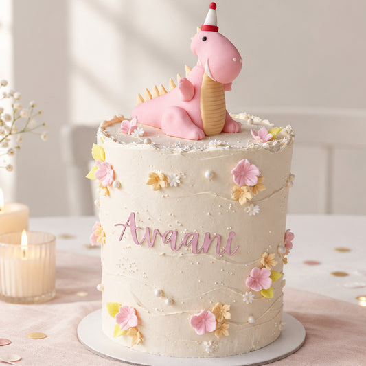 Cute pink dinosaur birthday cake decorated with pastel flowers
