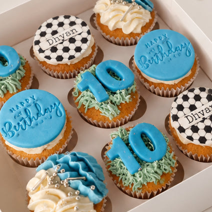 Personalised football cupcakes with name, age and Happy Birthday message topper.