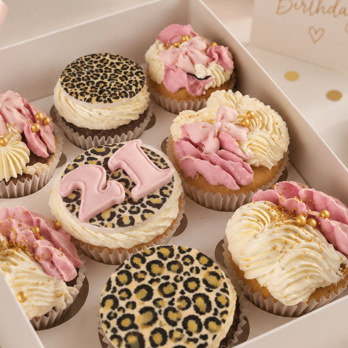 Feminine leopard print cupcakes with leopard toppers and bows
