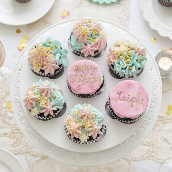 Pink and teal birthday cupcakes with gold details and personalised toppers for delivery in Basildon Essex