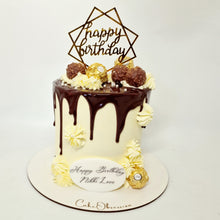 Load image into Gallery viewer, Our Ferrero Rocher Cake is a chocolate lover&#39;s dream come true. It&#39;s a rich and decadent chocolate cake adorned with a luscious chocolate drip and beautifully decorated with delicate swirls and Ferrero Rocher chocolates.

