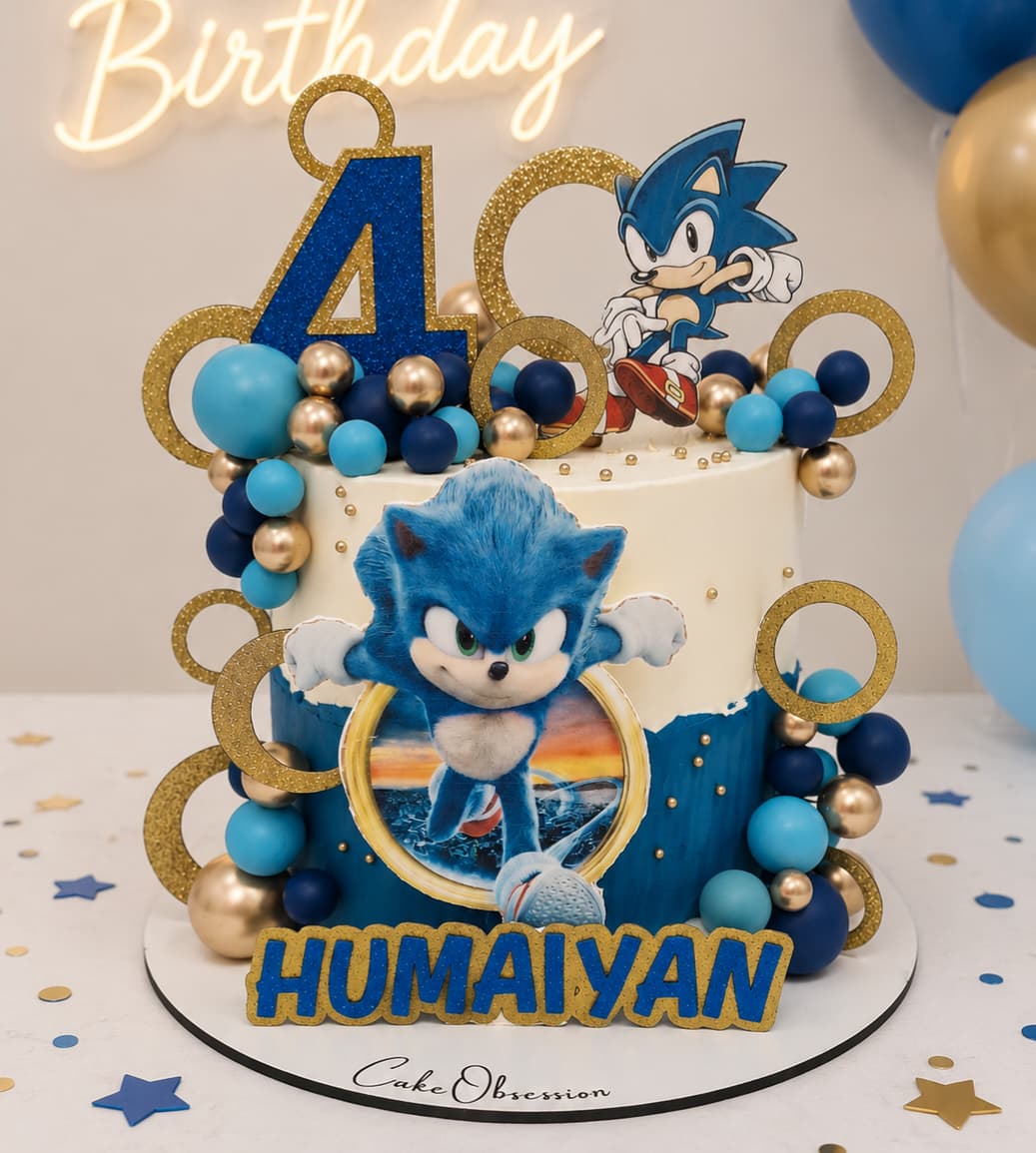 Sonic Birthday Cake Essex – personalised Sonic the Hedgehog themed birthday cake with name topper and blue decorations delivered by CakeObsession across Basildon and Essex.