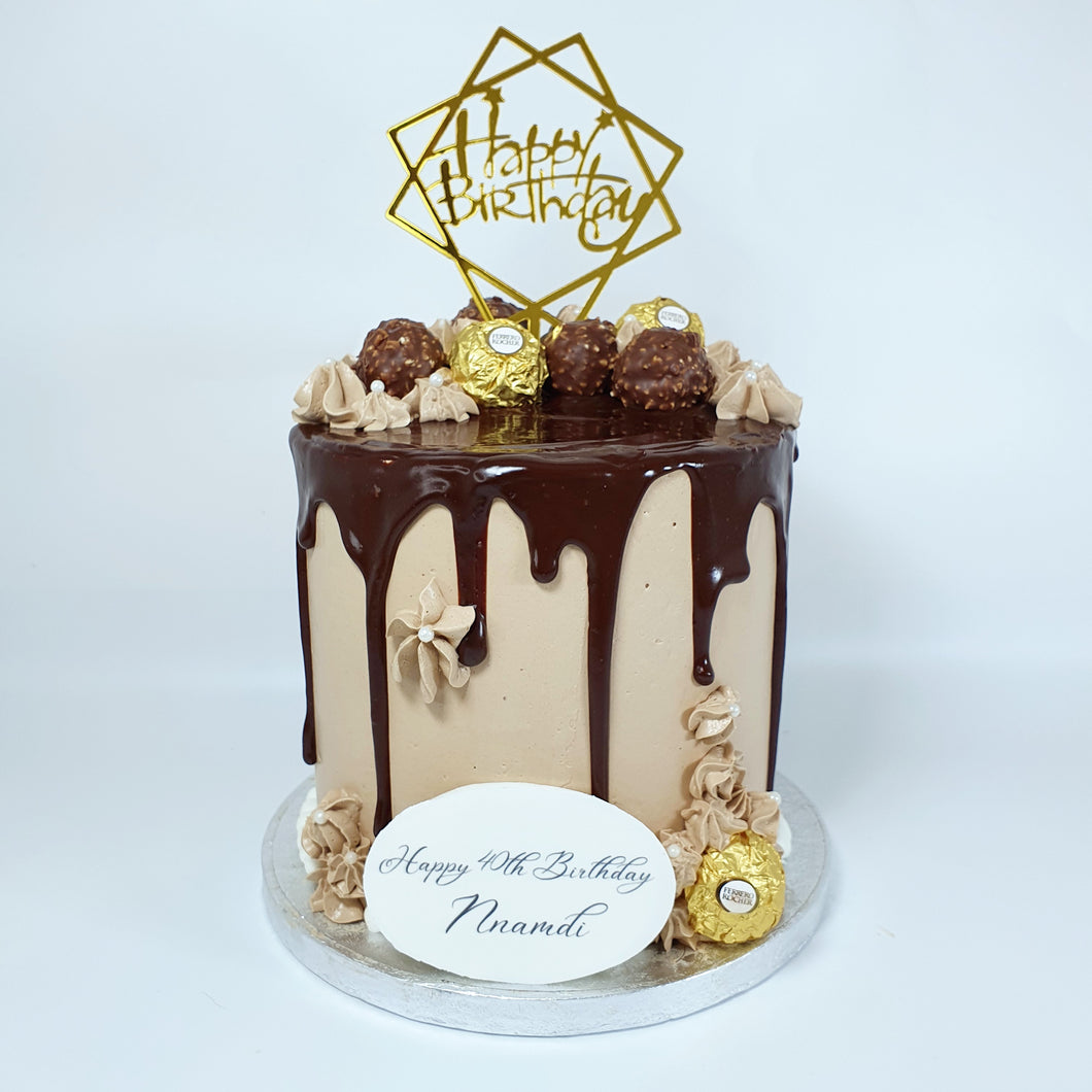 Our Ferrero Rocher Cake is a chocolate lover's dream come true. It's a rich and decadent chocolate cake adorned with a luscious chocolate drip and beautifully decorated with delicate swirls and Ferrero Rocher chocolates. Ferrero Rocher chocolate drip cake