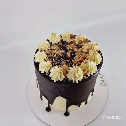 Peanut Butter Drip Celebration Cake with peanut butter sponge, chocolate drip, buttercream swirls, and peanut crumbs, handmade and personalised, perfect for birthdays and special occasions, available for delivery in Basildon and Essex.