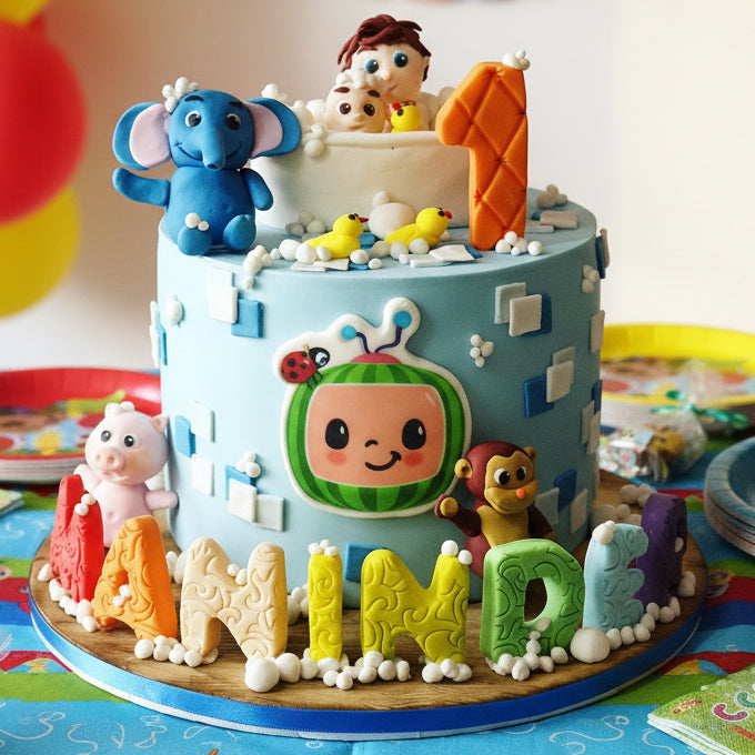 Cocomelon birthday cake in Basildon Essex featuring two children in a bathtub with bubbles, colourful fondant, handcrafted animal figurines, personalised with name and age.
