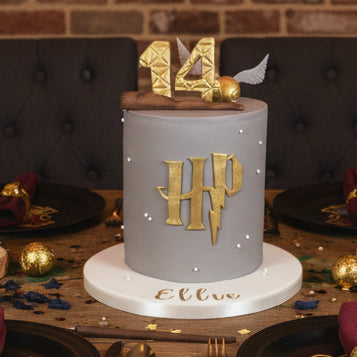 Harry Potter birthday cake in Basildon Essex, Victoria sponge or chocolate cake with grey fondant, HP letters, golden snitch, wand, personalised with name and age.