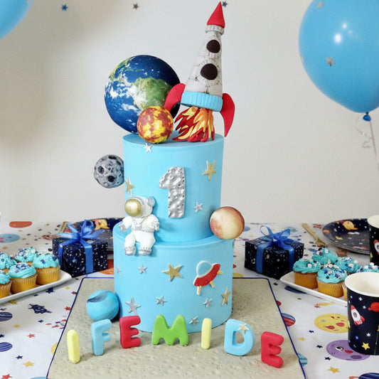 Space-themed birthday cake with planets, rocket, and spaceman figure, personalised name and age, birthday cake delivery Basildon Essex